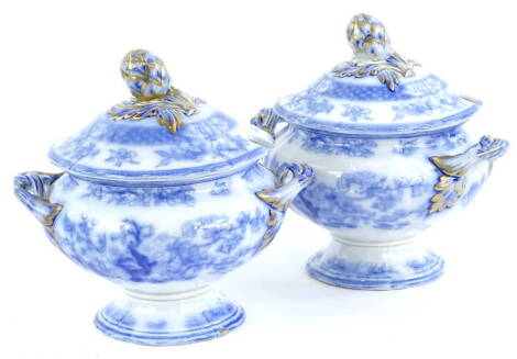 A pair of Victorian blue printed sauce tureens and covers, each with a flower and leaf finial, 18cm W.