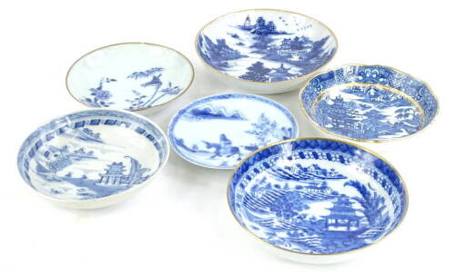 A collection of Chinese export porcelain, to include blue and white saucers decorated with landscapes, birds etc., various designs and sizes.