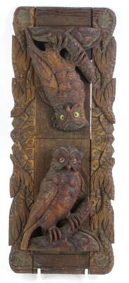A Black Forest adjustable book rack, carved with a pair of owls each with glass eyes, 35cm W. (AF)