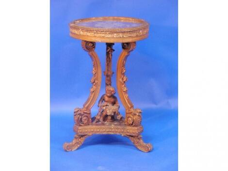 A French Regence style gilt gesso circular pedestal table