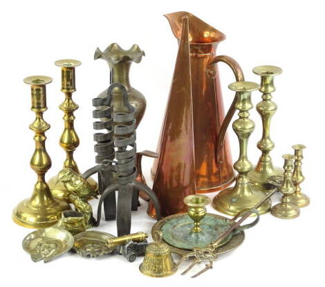 A quantity of general metalware, to include pair of brass candlesticks, iron candle stands, copper jug, etc.