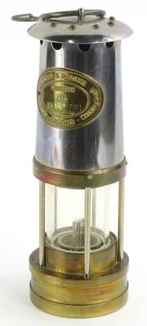 A brass and plated miners lamp, by Thomas and Williams of Aberdare, numbered 196791.