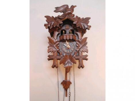 A Black Forest cuckoo clock with a Swiss musical movement