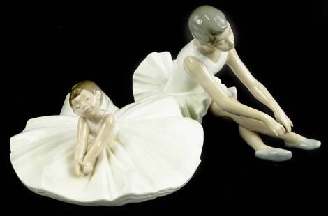 Two Nao ballerinas, each seated, both boxed.