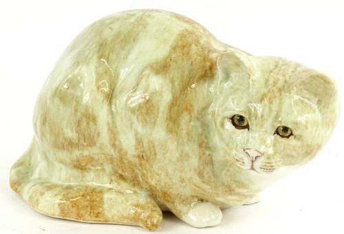 A Winstanley ceramic model of a crouching ginger tom cat, scripted mark to underside, number 5, 33.5cm W.