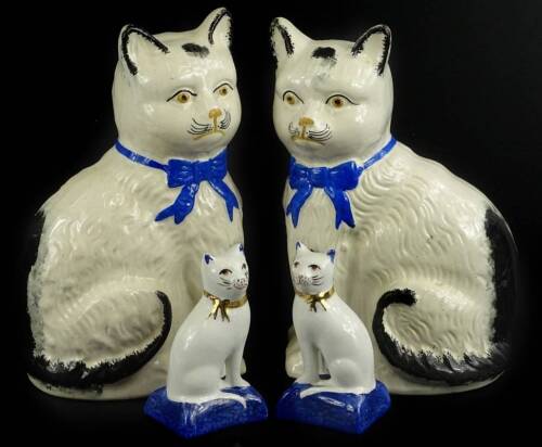 Two pairs of ceramic cats, to include a Staffordshire type, taller figures, 20cm H, and a pair of Royale Stratford examples, 10cm H.