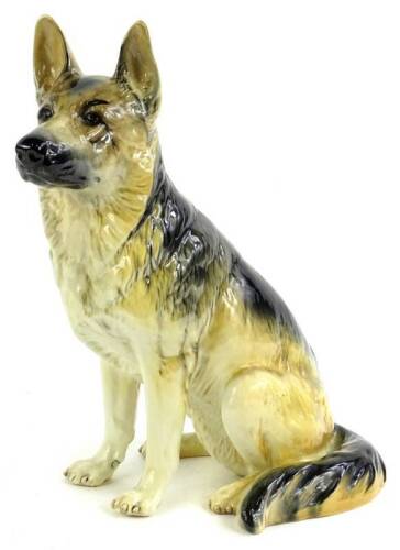 A large Beswick ceramic model of a seated German Shepherd or Alsatian, number 410 to underside, 34cm H.