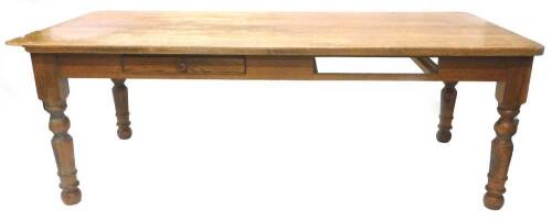 A large oak kitchen table, the rectangular top above two frieze drawers on turned legs, 99cm x 213cm.