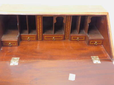 An Edwardian mahogany and chequer banded bureau, with four drawers on ogee bracket feet. - 4