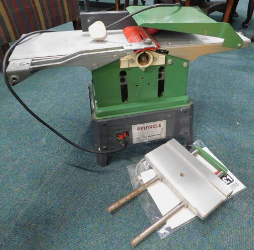 A Pinnacle Excel wood working planer and thicknesser machine, with instructions.