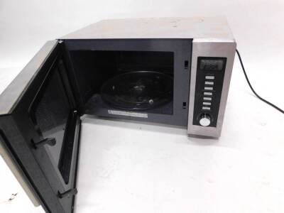 A Kenwood silver microwave oven. - 2