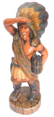 A carved wooden tobacco type figure of a Native American Indian, wearing stars and stripes, 94cm H.