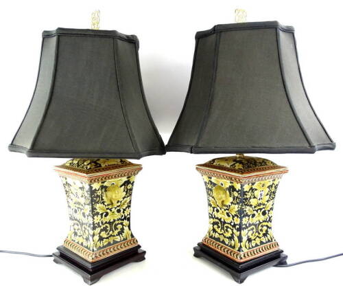 A pair of oriental style table lamps, each with a tapering grey shade, 68cm H.