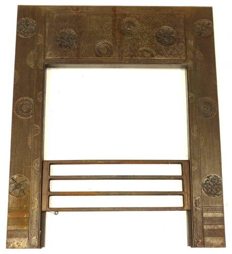 A Victorian aesthetic movement fire surround, after Thomas Jeckyll, decorated overall with flower heads, geometric patterns etc, 90cm x 74cm.