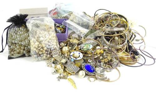 A large quantity of modern costume jewellery and effects, to include bangles, ladies wristwatches, gilt metal brooches, marcasite set, brooches, dress rings, etc., Rotary ladies wristwatch etc. (1 tray)