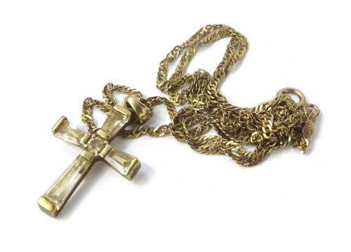 A continental yellow metal and glass crucifix, and a yellow metal chain, both stamped 375, 2.9g all in.