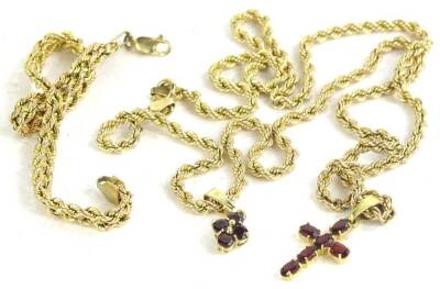 A 9ct gold necklace and bracelet, the 9ct gold fancy link necklace set with 9ct gold garnet floral pendant, an 18ct gold garnet set crucifix pendant, 8g all in, and a two row 9ct gold bi-colour twist bracelet, 3.4g. (4)