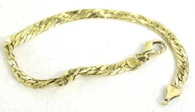 An articulated bracelet, with etched design, stamped to clasps 14k, 8.6g. (AF)