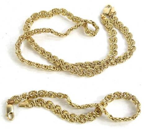 A 9ct gold necklace and bracelet set, to include a circular weave design bracelet, and a matching 9ct gold necklace, 7.7g. (2)