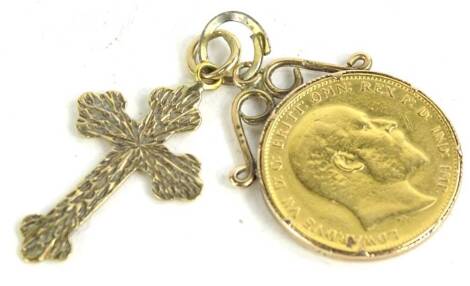 An Edward VII full gold sovereign pendant, dated 1904, in a 9ct gold pendant setting, set with a 9ct gold cross, 10.8g all in.