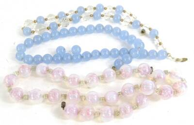 Three natural stone necklaces, to include a clear pink/blue coloured stone necklace, a pale blue stone beaded necklace with a gold plated clasp and another with pale blue stone and crystal stone beads. (3)