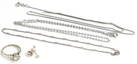 Three fine link silver chains, to include two necklaces, one box link, one fancy link and a silver bracelet, together with a dress ring and pair silver earrings. (a quantity)