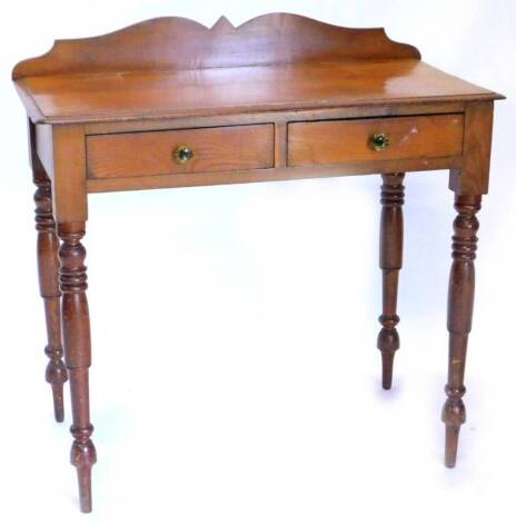 A Victorian ash side table, with a raised back, above two frieze drawers, each with green moulded glass handles, on turned tapering legs, 81cm W.