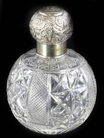 An Edwardian cut glass globular scent bottle, with embossed silver lid, engraved with a monogram, Birmingham 1906, 14cm H.