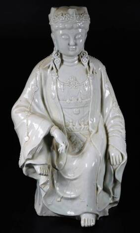 A Chinese blanc de chine figure, of a seated Buddhistic female, 42cm H.