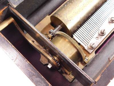 A 19thC cylinder musical box, eight airs with Fabrique De Geneve label, with 24cm W brass cylinder, graduated comb, with articulated handle, in an inlaid case, 14cm H, 46cm W, 22cm D. - 4