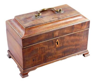 A George III mahogany tea caddy, with brass handle and a part fitted interior, on ogee bracket feet, 18cm H, 24cm W, 13cm D.