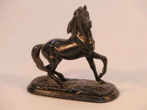 A Spelter figure of a prancing horse on cast base