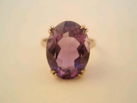 A 9ct gold dress ring set with an oval amethyst