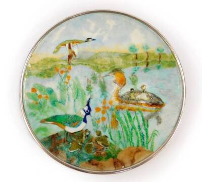 A silver and cloissonne enamel circular dish, decorated with grebes and lapwings, against a river landscape, Dorothy Budd, London 1990, 5.75oz all in, 12.5cm Dia.