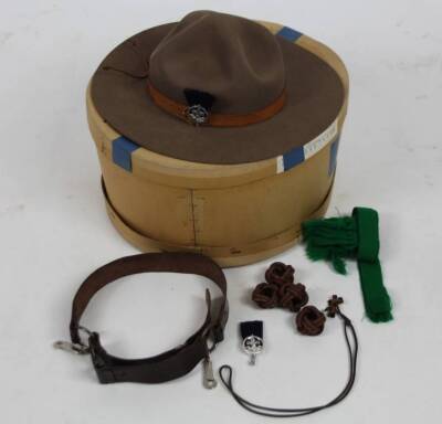 A 20thC Canadian Mountie hat, by Christy's of London, with a brown leather banding and fleur-de-lis Quebec emblem, 36cm W, interior dimensions approx. 21cm x 16cm, with chin strap. (boxed) - 2