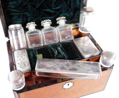 A Victorian walnut cased travel box, the shaped rectangular body centred by a mother of pearl cartouche, with ebonised outline and fitted interior, containing a number of various jars, bottles, etc., some with plated lids, with a green velvet lining and s - 3