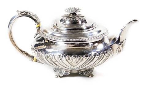 A George IV silver teapot, by Pierce and Burrows, of melon form, partially gadrooned with compressed knop, acanthus leaf handle and quadruple leafy feet, London 1827, 13cm H, 23oz all in.
