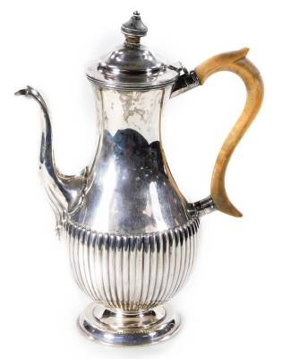 A Victorian silver coffee pot, by Hancock & Co., part reeded, on a circular foot, London 1882, 29cm H, 20oz all in.