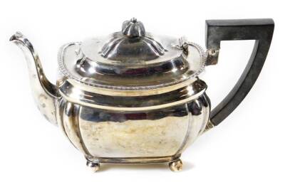 An Edwardian bachelor's teapot, of shaped form, with angular handle, on ball feet, Sheffield 1903, 12cm H, 13oz all in.