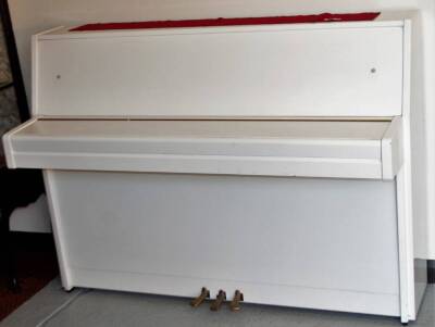A late 20thC Yamaha white upright piano, iron framed, 109cm H, 151cm W, 63cm D. - 2