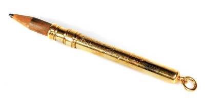 A 18ct gold propelling pencil, by Garrard & Co, of cylindrical form with ring top and inner pencil, part engraved Good Luck In The New Century Mentmore January 1st 1901, marked 18ct, the case 8cm W, 13g all in.