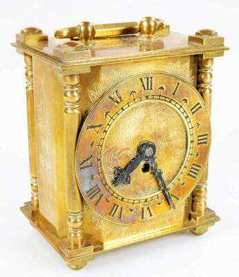 An early 20thC Smith's lantern clock, the 7.5cm Dia, chapter ring with Roman numerals, revealing a keywind movement, in a shaped brass case, on compressed feet, 12cm H.