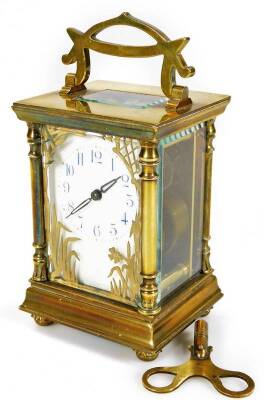 A late 19thC brass carriage clock, with ivory coloured 6cm W dial with Arabic numerals, stencilled with gilt flowers and revealing a twin train keywind movement, in a five part glazed case, on compressed orb feet, flanked by quarter columns, surmounted by