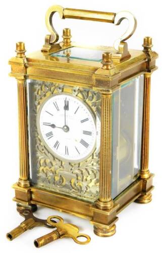 A 19thC brass repeating carriage clock, the 6cm Dia. enamel dial with Roman numerals marked Hancocks & Co, 58 Bruton Street, London, with a blind fret floral back plate, revealing a twin train movement striking on a gong, the back plate marked for Richard