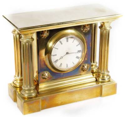 A 19thC French brass mantel clock, marked V A B Brevete, the 9.5cm Dia. Roman numeric dial in an architectural case, set with four columns revealing a keywind movement, marked to the back plate, 23cm H.