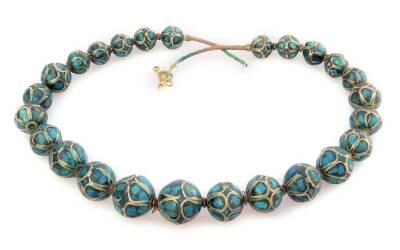 A Middle Eastern style necklace, with graduated design beads, each set with blue turquoise type coloured decoration, on wire necklace.