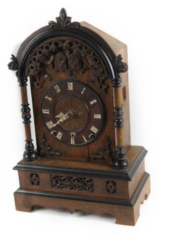 A 19thC Black Forest oak cuckoo and quail chiming clock, with an 18cm Dia. Roman numeric chapter ring , in a heavily carved case, with upper articulated quail and cuckoo before a keywind movement, 58cm H.