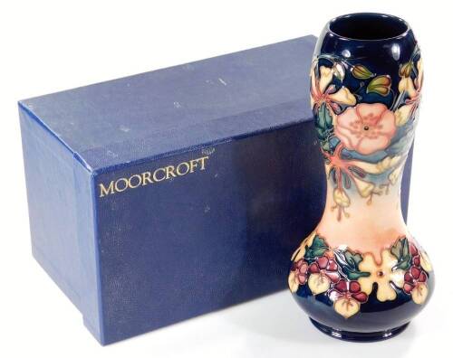 A Moorcroft Oberon Honeysuckle pattern vase, marked beneath, 29cm H. (boxed)