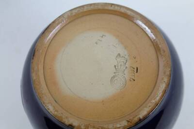 An early 20thC Royal Doulton stoneware jar, shield crest on blue ground, 18cm H, and another similar, impressed marks beneath. (2) - 2