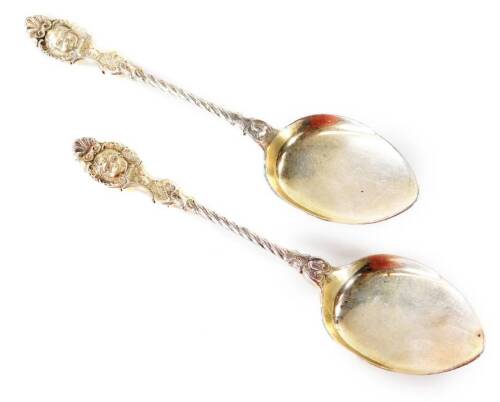 A pair of 19thC preserve spoons, each with elaborate entwined handles, set with masks, import marks for 1899, 16cm W. (2)